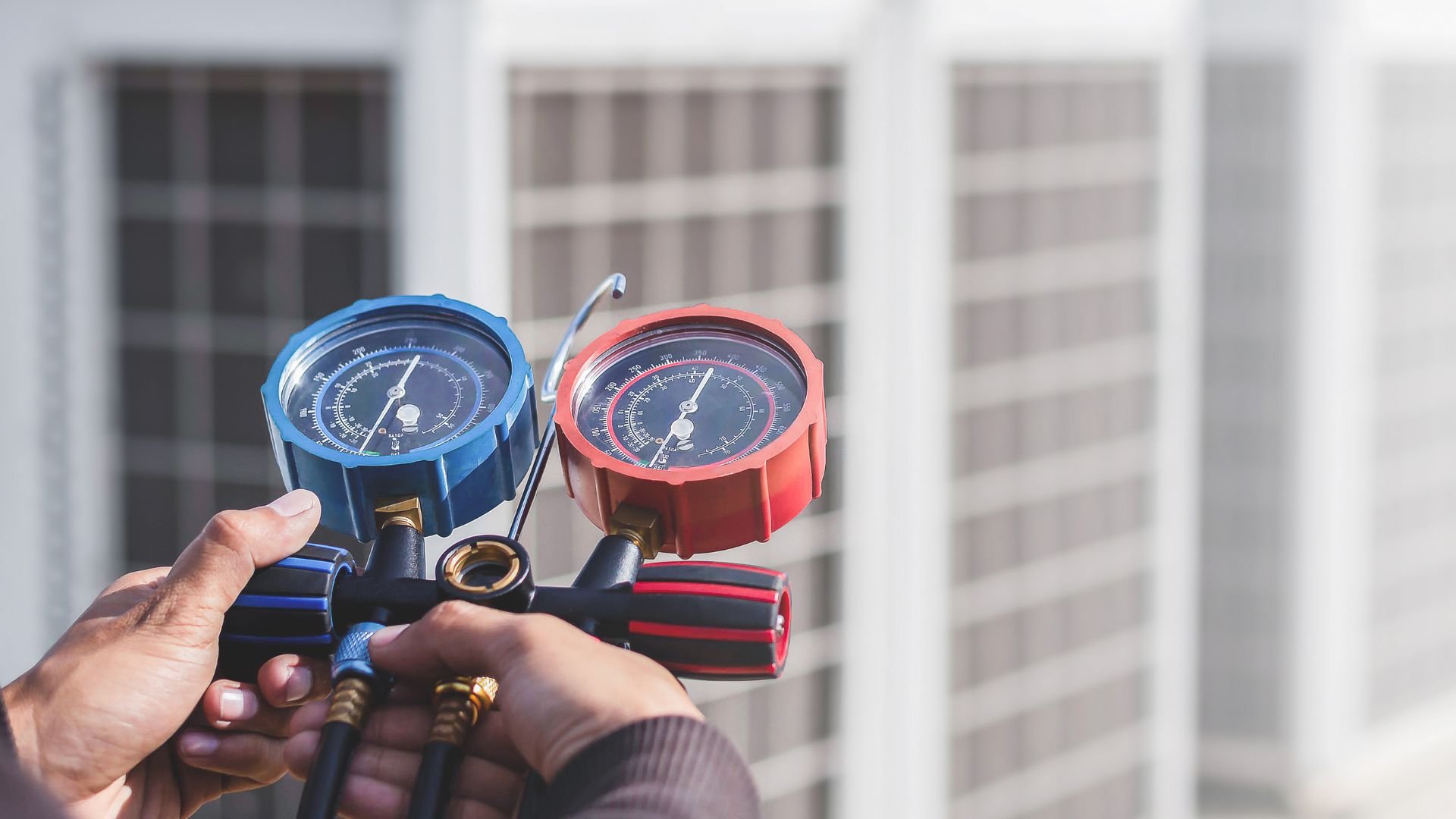 Blue and red pressure gauges used for measuring system performance