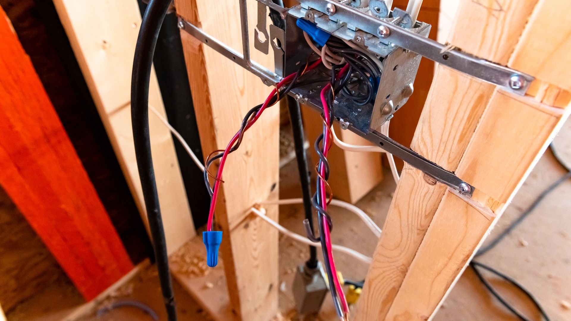 Electrical wiring with colored wires connected to metal junction box